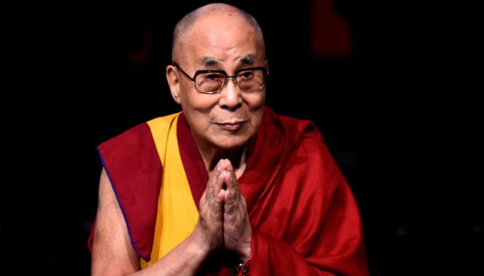Tibetan spiritual leader El Dalai Lama, pattern of children in Crossfire, gestures in an event called Compassion in Action in Londnderry, Ireland of the North September 10, 2017. - Reuters