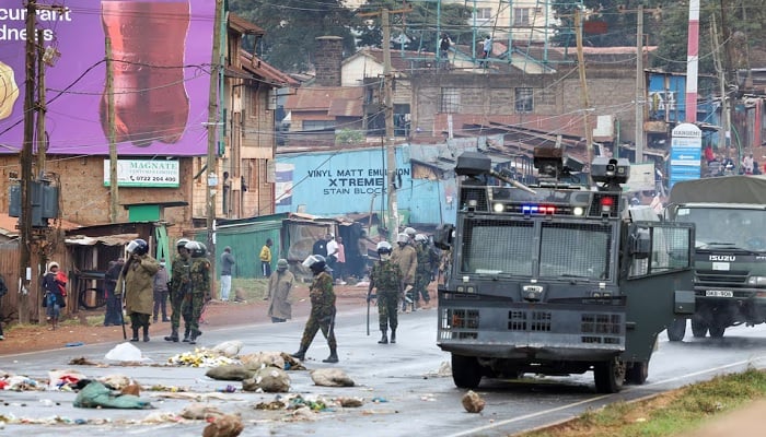 The riot police officers clear a blocked road during anti -government protests called Saba Saba Peoples March in the Kangmii area of Nairobi, Kenya, on July 7, 2025.