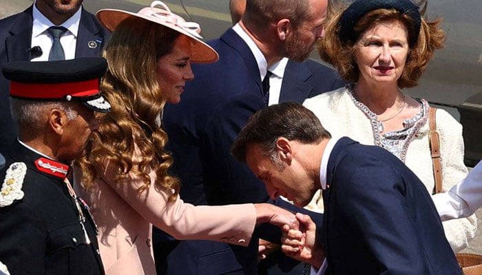 Kate Middleton became off guard by the French presidents kiss gesture