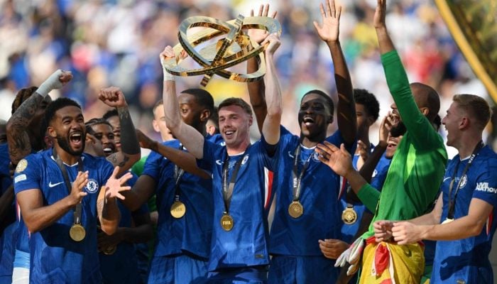 Chelsea's midfielder, Cole Palmer, lifts the trophy with players during the awards ceremony for the FIFA 2025 Club World Cup champion at East Rutherford, New Jersey, Sunday. - AFP