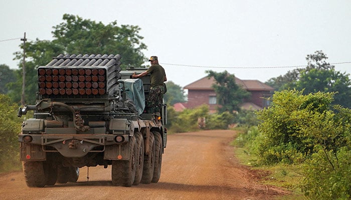 A Cambodian military personnel is in a multiple rocket launcher graduated from BM-21 after Thailand and Cambod