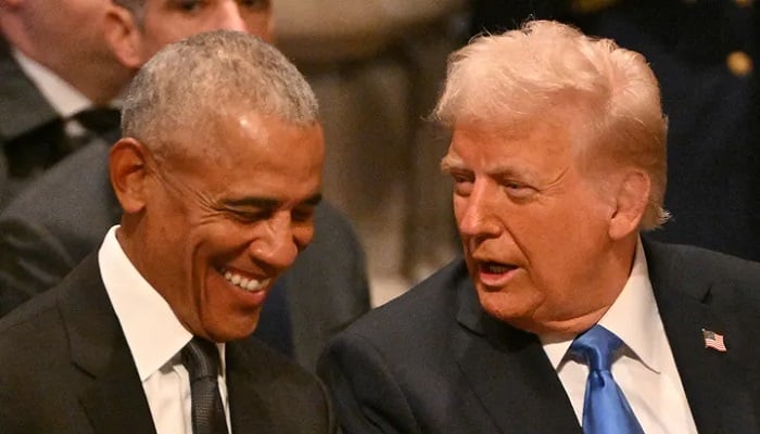 Former President Barack Obama talks to President Donald Trump. –AFP/File