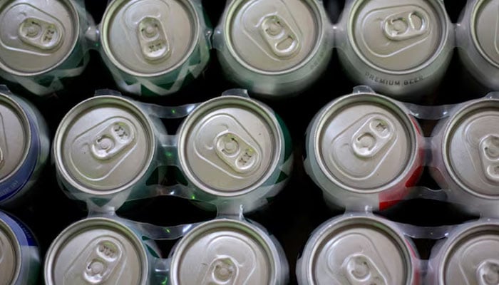 Beer cans are exhibited in a store in Ciudad Juárez, Mexico, July 31, 2018. - Reuters