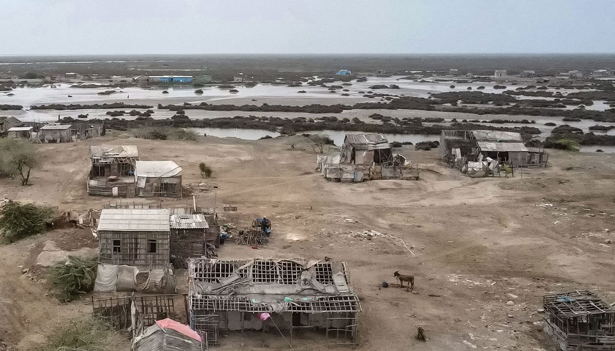 Abandoned houses are shown in one of the towns of the city of Kharo Chan, in the Delta del Indo on June 25, 2025. - AFP