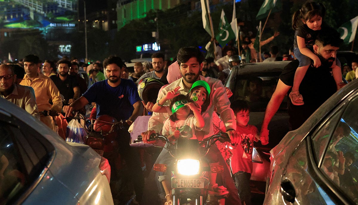 People participate in the celebration of Independence Day in Lahore on August 14, 2025. - Reuters