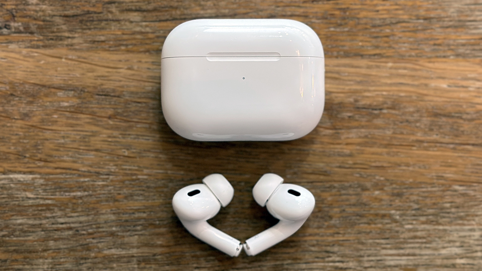 The Airpods Pro 2 on a table with case