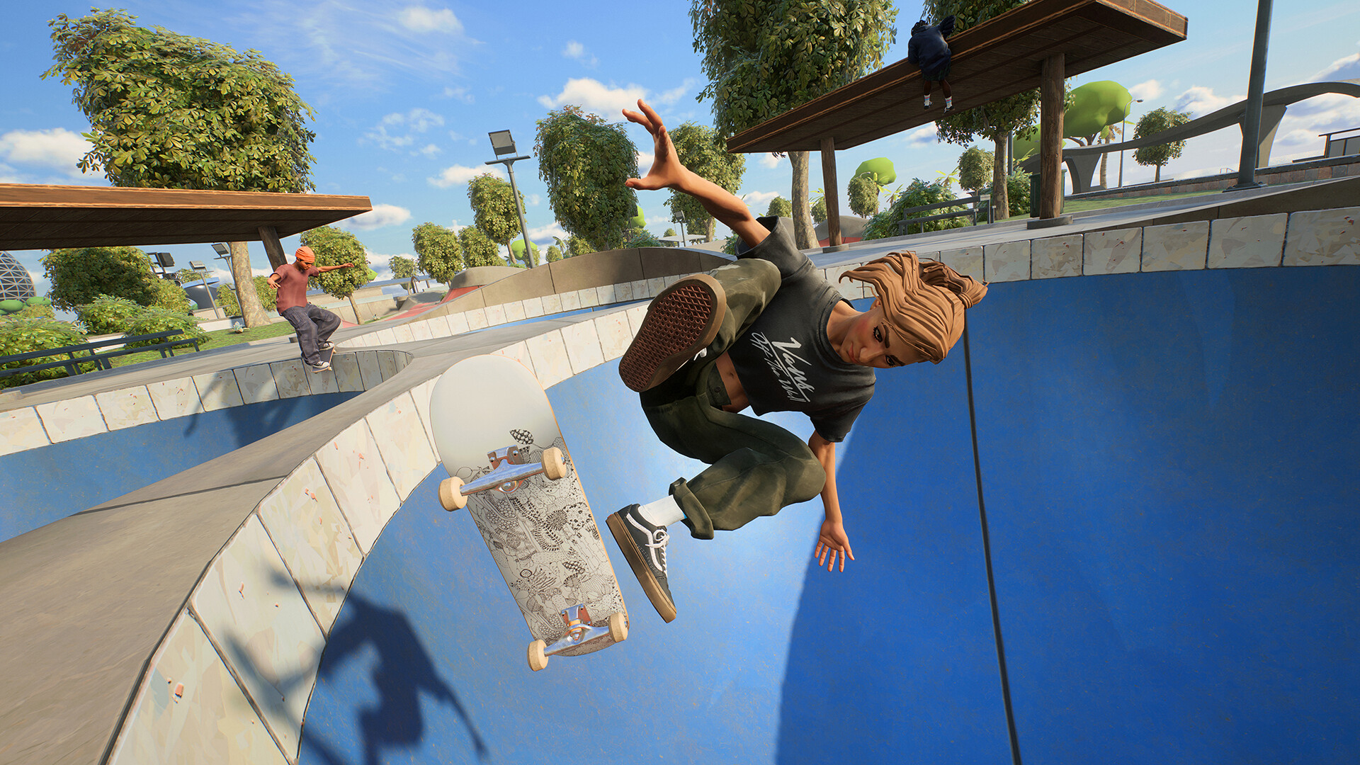 A skatein performs a flip trick at the top of a bowl