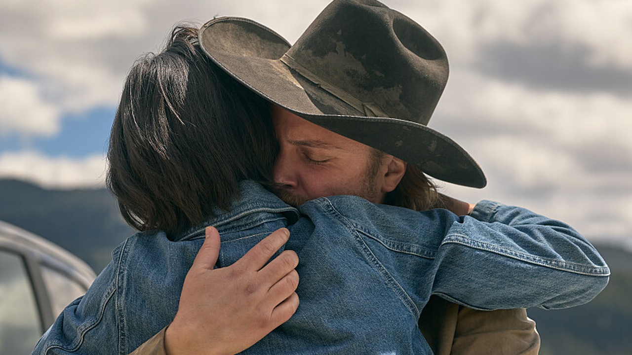 Kelsey Asbille as Monica Long and Luke Grimes like Kacey Dutton embrace in Yellowstone Season 5, part 2