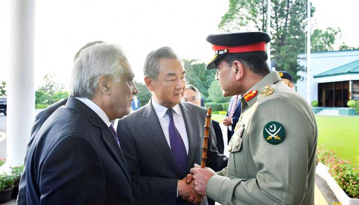 Chief of field personnel also munir (right) is agitated with Chinese Foreign Minister Wang Yi in Islamabad on August 22, 2025. - ISPR