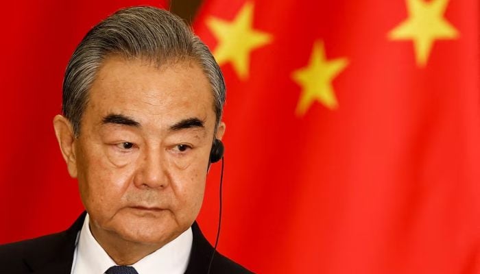 China's Foreign Minister Wang Yi listens during a joint press conference with Indonesian Foreign Minister, Marsudi Reto (not in the photo) after his bilateral meeting in Yakarta, Indonesia, April 18, 2024. - Reuters