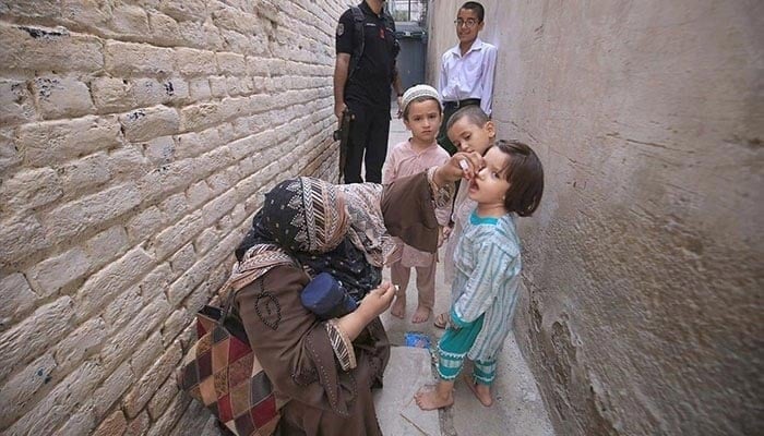 Poly working women who manage children's polio in Warsak Road during the polio vaccination campaign in Peshawar on September 9, 2024.