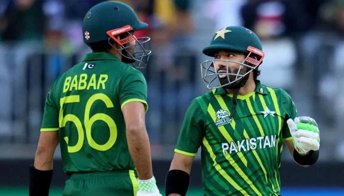 The Pakistan Babar Azam (L) and Mohammad Rizwan Cricket team player share a moment. - ICC/File