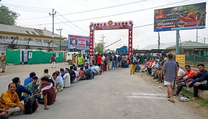 Hindu pilgrims wait for their record in a transit camp in Pantha Chowk on the outskirts of Srinagar on July 2, 2025. - AFP