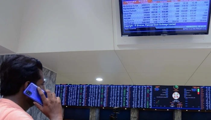 Broker is busy in trade in the Pakistan Stock Exchange in Karachi on Wednesday, January 1, 2025. - PPI