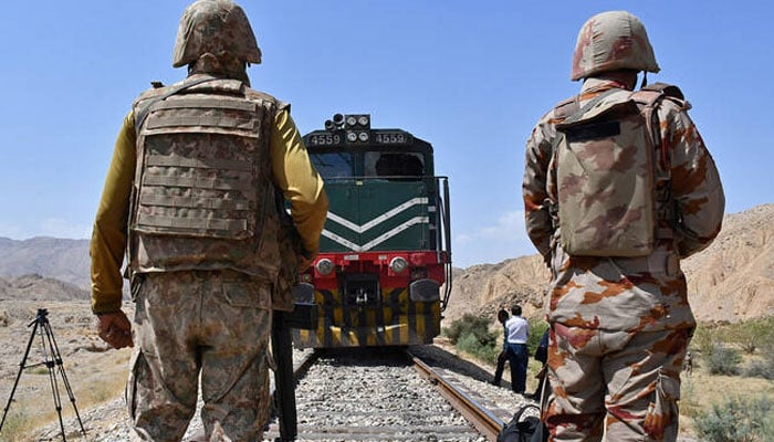 The border body soldiers remain guard at the siege site after the terrorists ambush a train in the remote mountainous area, in Pehro Kunri in Baluchistan on March 15, 2025. - Reuters