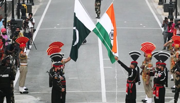 The staff of the Pakistan Rangers and Indias BSF shown during the flag's descent ceremony at the Wagah border crossing. - Reuters/file