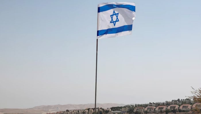 An Israeli flag stir, as part of the Israeli settlement of Maale Adumim is visible in the background, in the West Bank occupied by Israel, August 14, 2025.-Reuters