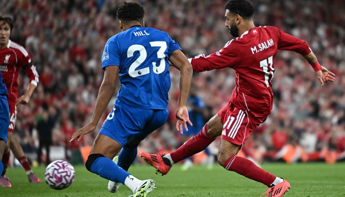 The Egyptian striker of Liverpools #11 Mohamed Salah (R) scores his fourth goal during the English Premier League football match between Liverpool and Bournemouth in Anfield in Liverpool, northwest of England on August 15, 2025. - AFP.