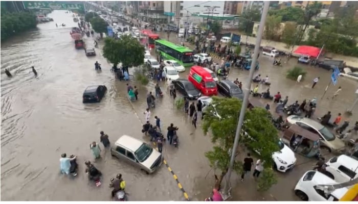 Cars stranded on the road after strong roads submerged in Karachi on August 19, 2025. - PakGazette News