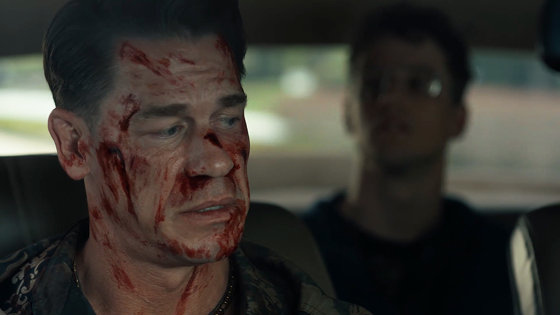 A bloody Smith Smith looking behind him to Adrian Chase/Vigilante in the Pacifier Season 2 Episode 5