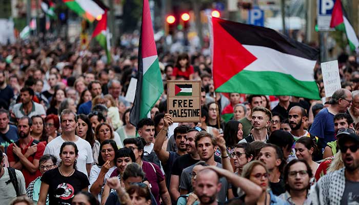 A protester holds a sign that reads Free Palestine during a protest in support of the Palestinians, in Barcelona, ​​Spain, September 18, 2025. - Reuters