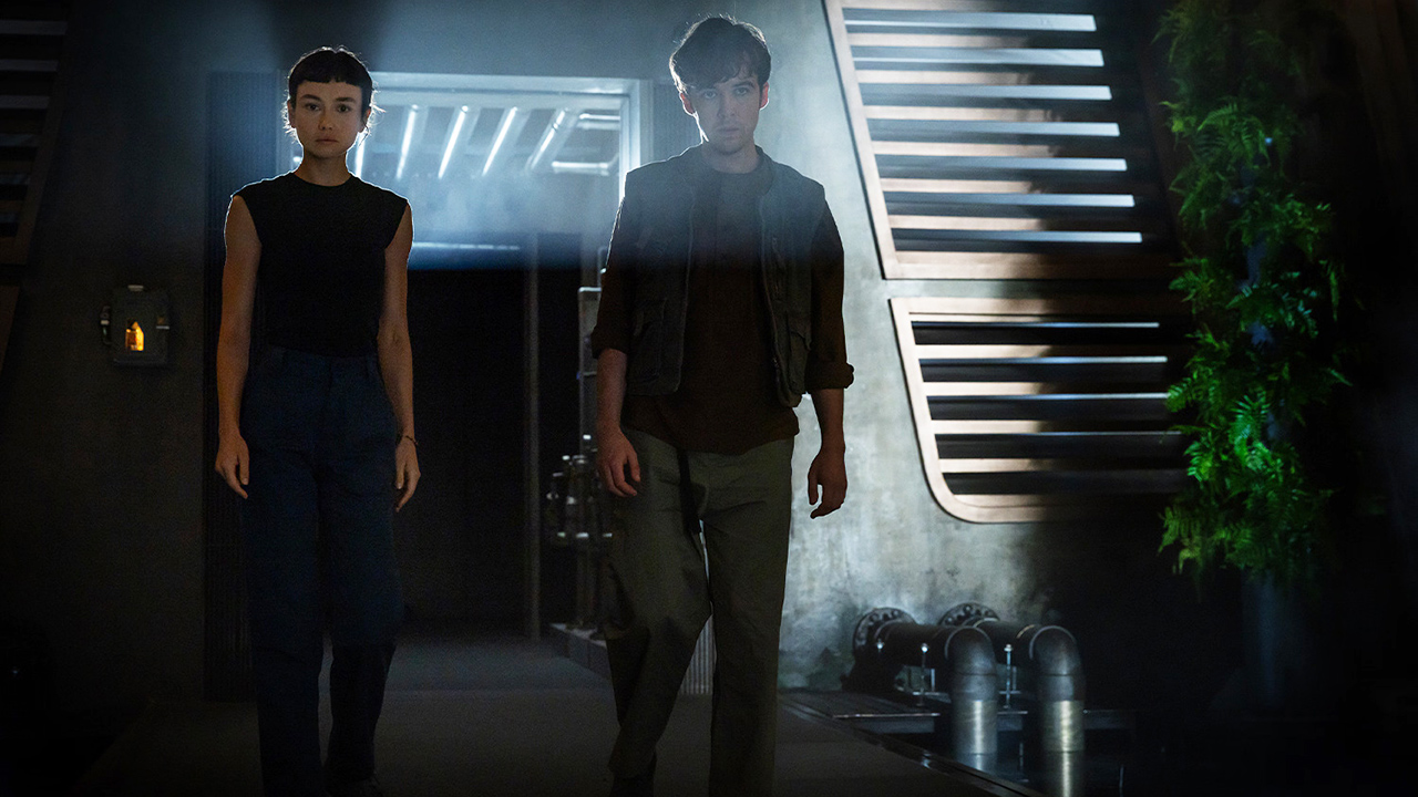 Wendy and Joe standing in a room with little light in Alien: Earth season 1 episode 8