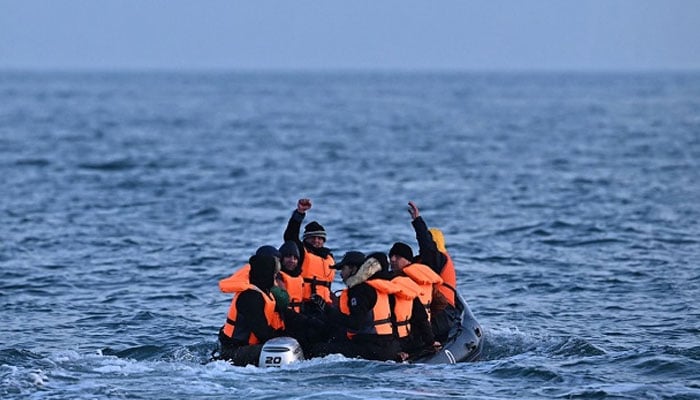 Migrants travel in an inflatable boat through the La Mancha Canal, destined to Dover on the southern coast of England. - AFP/file