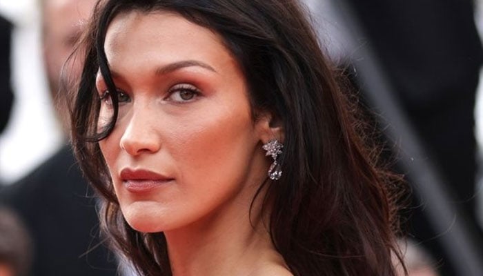Bella Hadid walks through Saint Laurent after the treatment of Lyme's disease