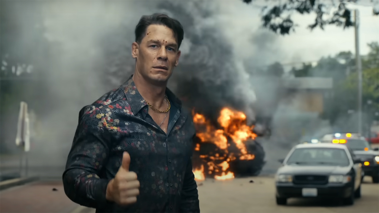 Christopher Smith giving a thumb up with a flame car at the bottom of season 2
