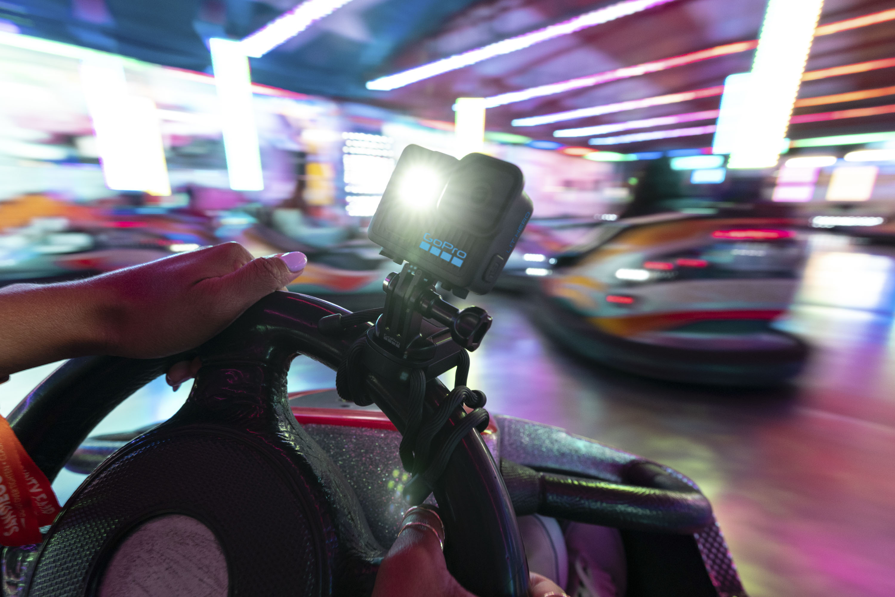Gopro Lit Hero Action Cam mounted on the steering wheel of a dodge 'm
