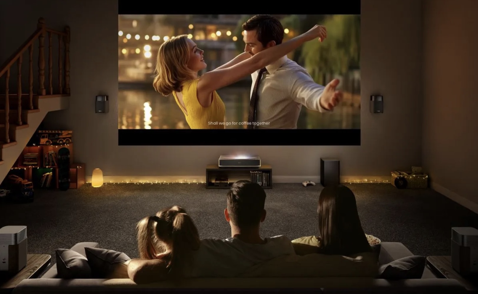 Hysense P1T projector life image that shows a couple looking at La Land in a dark room