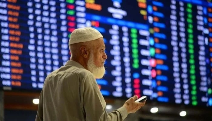 Broker is busy in trade in the Pakistan Stock Exchange (PSX) in Karachi on Wednesday, October 23, 2024. - PPI