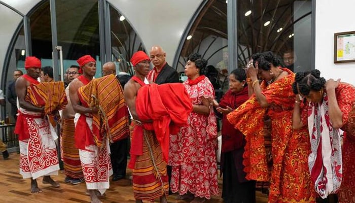The men carry the three skulls of Sakalava as descendants of the Arc of the King of Sakalava during a welcome ceremony for its restitution to Madagascar from France at the International Airport of Ivato in Antananarivo on September 1, 2025.