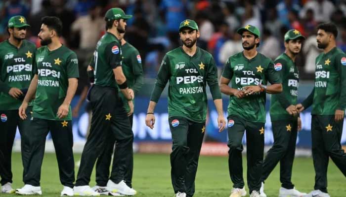 The Pakistan team led by Salman Ali Agha leaves the field after its defeat against India in the T20 Asia Acc Asia Cup match at the Dubai International Cricket Stadium in Dubai on September 14, 2025. - AFP