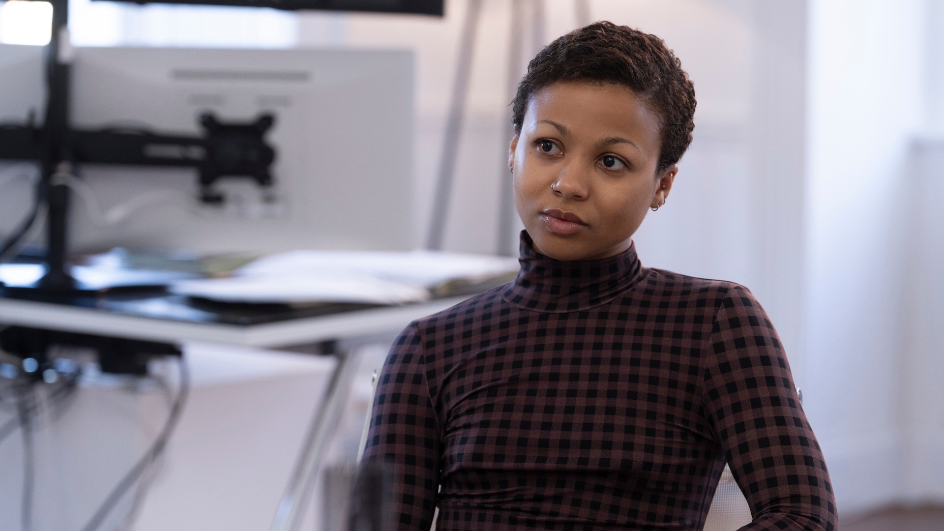 Harper looks aside in season 3 of the industry