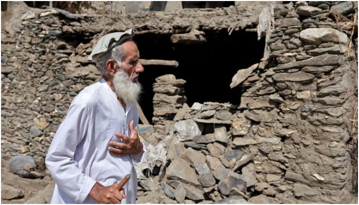 An old farmer passes through a damaged house after a mortal earthquake that hit the provinces of Afghanistans Kunar and Nangarhar, in the Masud village in the district of Nurgal, Kunar province, Afghanistan, September 4, 2025.