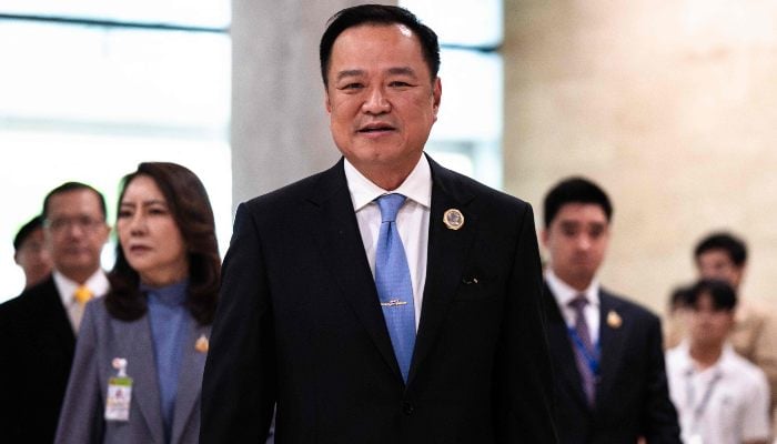 The Bhumjaithai party leader, Anutin Charnvirakul, arrives at Parliament in Bangkok on September 5, 2025. - AFP