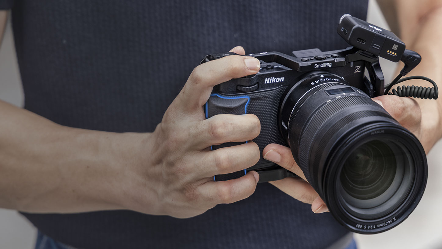 Smallrig cage kit for the Nikon ZR, attached to the camera and subject by the cameraman