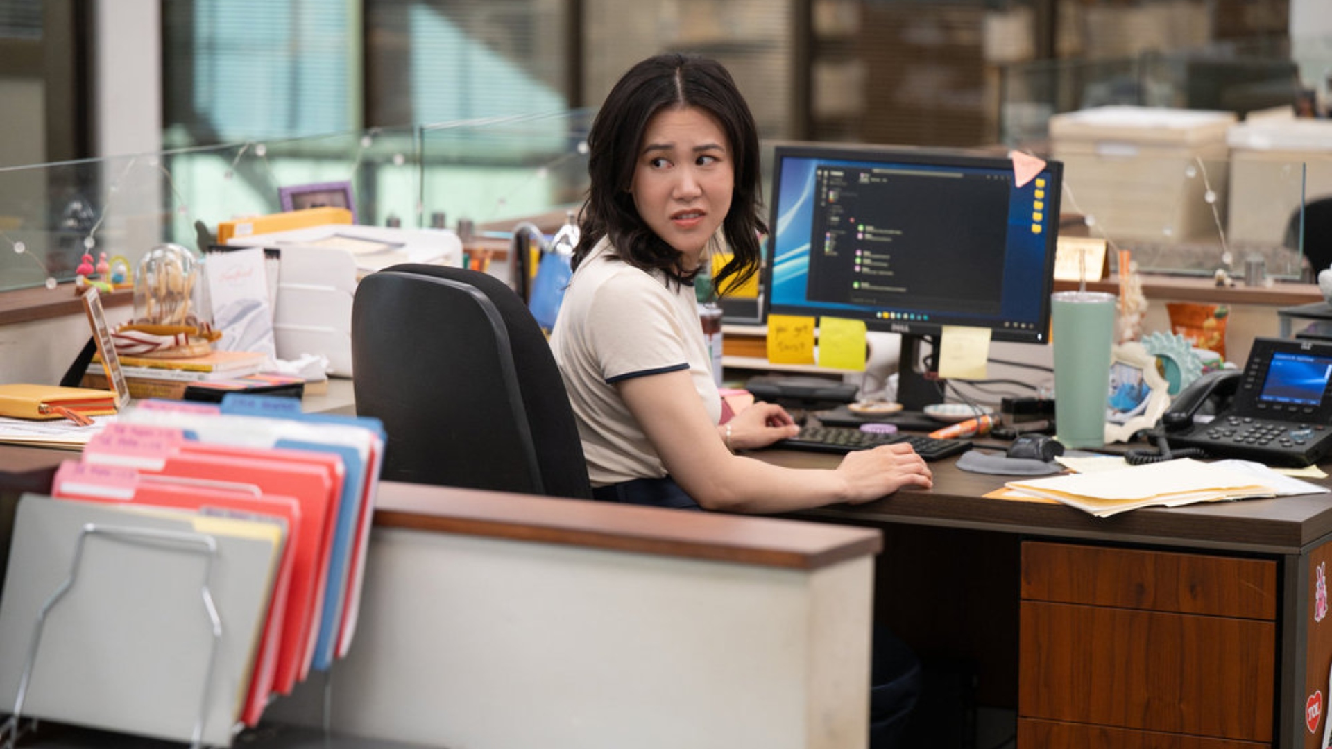 Nicole sits on her desktop in season 1 season