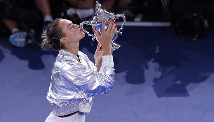 Aryna Sabalenka poses with her trophy after defeating Amanda Anisimova of the United States during her final party of the singles for women on the fourteenth day of the United States Open of the United States in the Usta Billie Jean King National Tennis Center on September 6, 2025 in New York City. - AFP