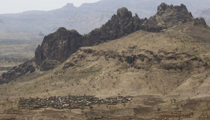 A photo taken from a helicopter on June 19, 2017 shows an aerial view of the beating city devastated by the war in the mountainous area of Jebel Marra in the center of Darfur, Sudan. - AFP