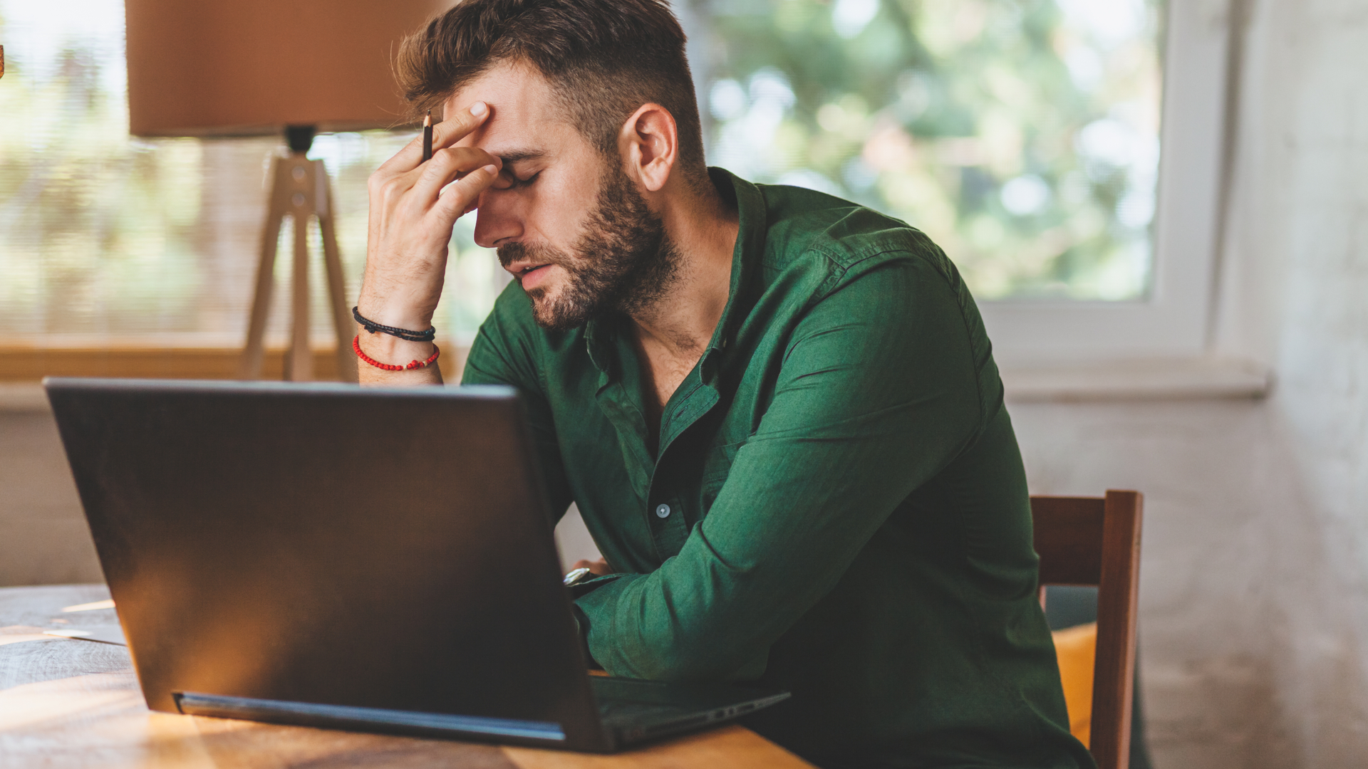 Man who seems frustrated in his Windows 10 laptop