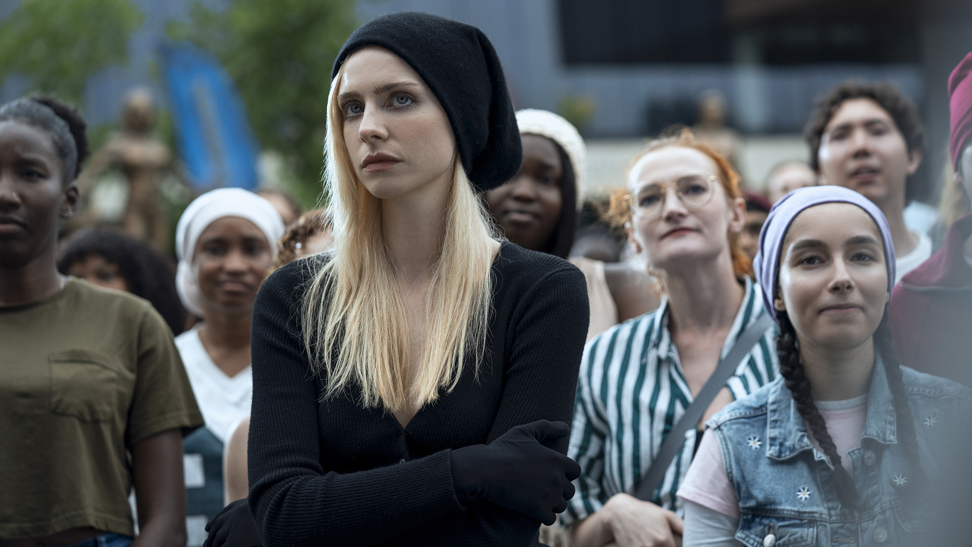 Cate Dunlap standing in a multitude of people in generation V of season 2