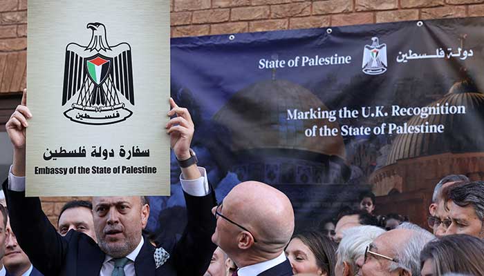 Husam Zomlot, head of the Palestinian mission to the United Kingdom, holds a plaque that reads the Embassy of the Palestine State during a ceremony after the British government announced the formal recognition of a Palestinian state, at the Missions headquarters in London, Great Britain, September 22, 2025. - Reuters