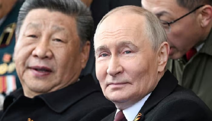 Russian President Vladimir Putin, and his Chinese counterpart, Xi Jinping, attend a military parade on Victory Day in Moscow, Russia, May 9, 2025. - Reuters