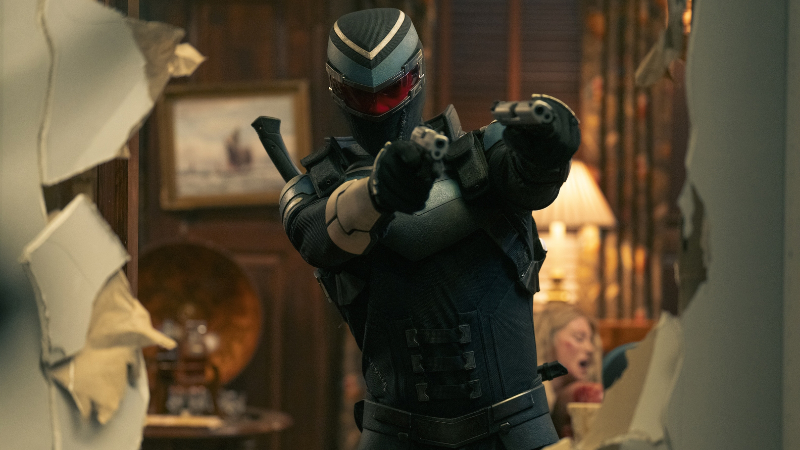 Adrian Chase/Vigilante with their guns raised in Peacemaker Season 2 Episode 7