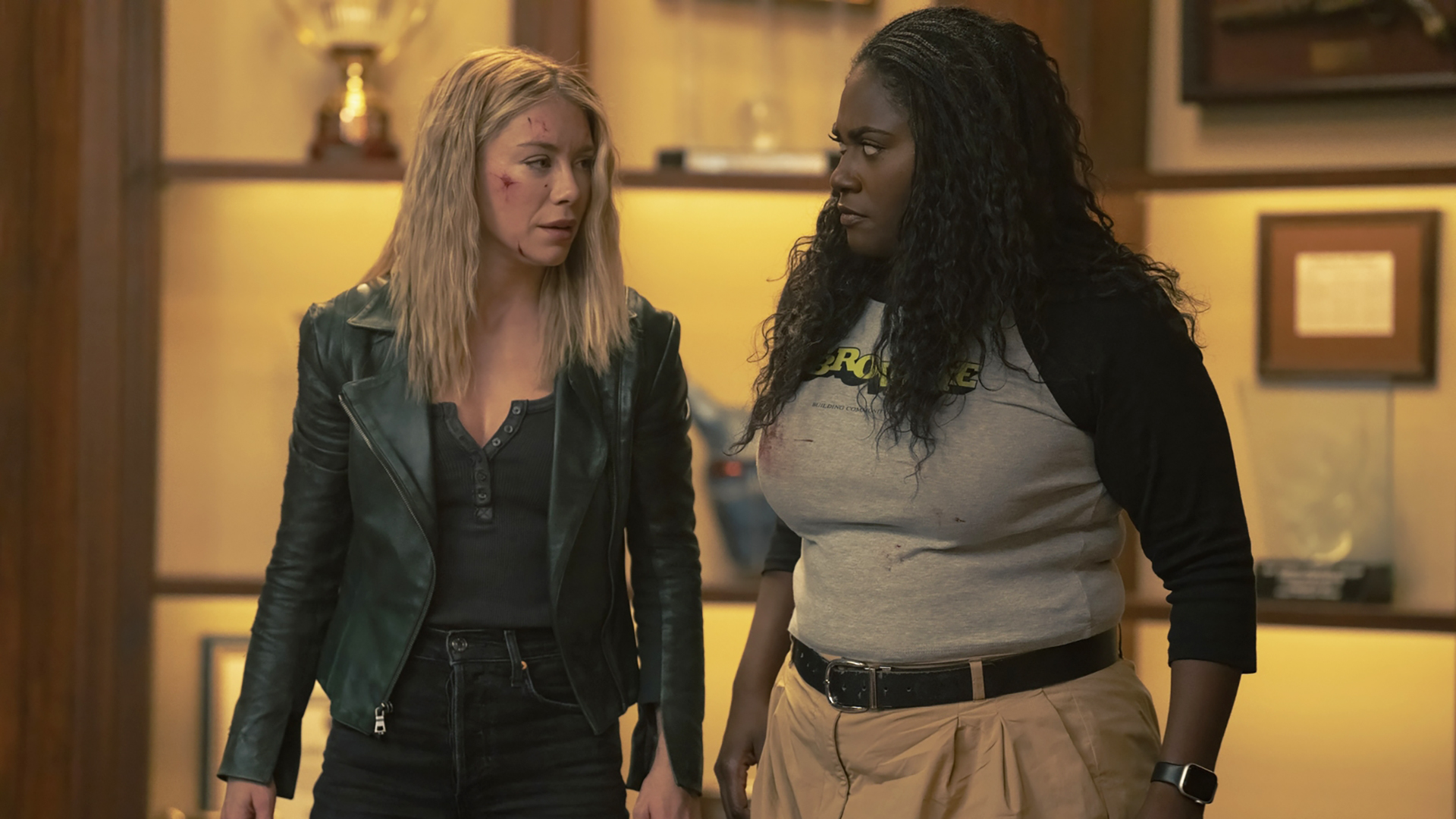 Emilia Harcourt and Leota Adebayo look at Peacemaker Season 2 Episode 7