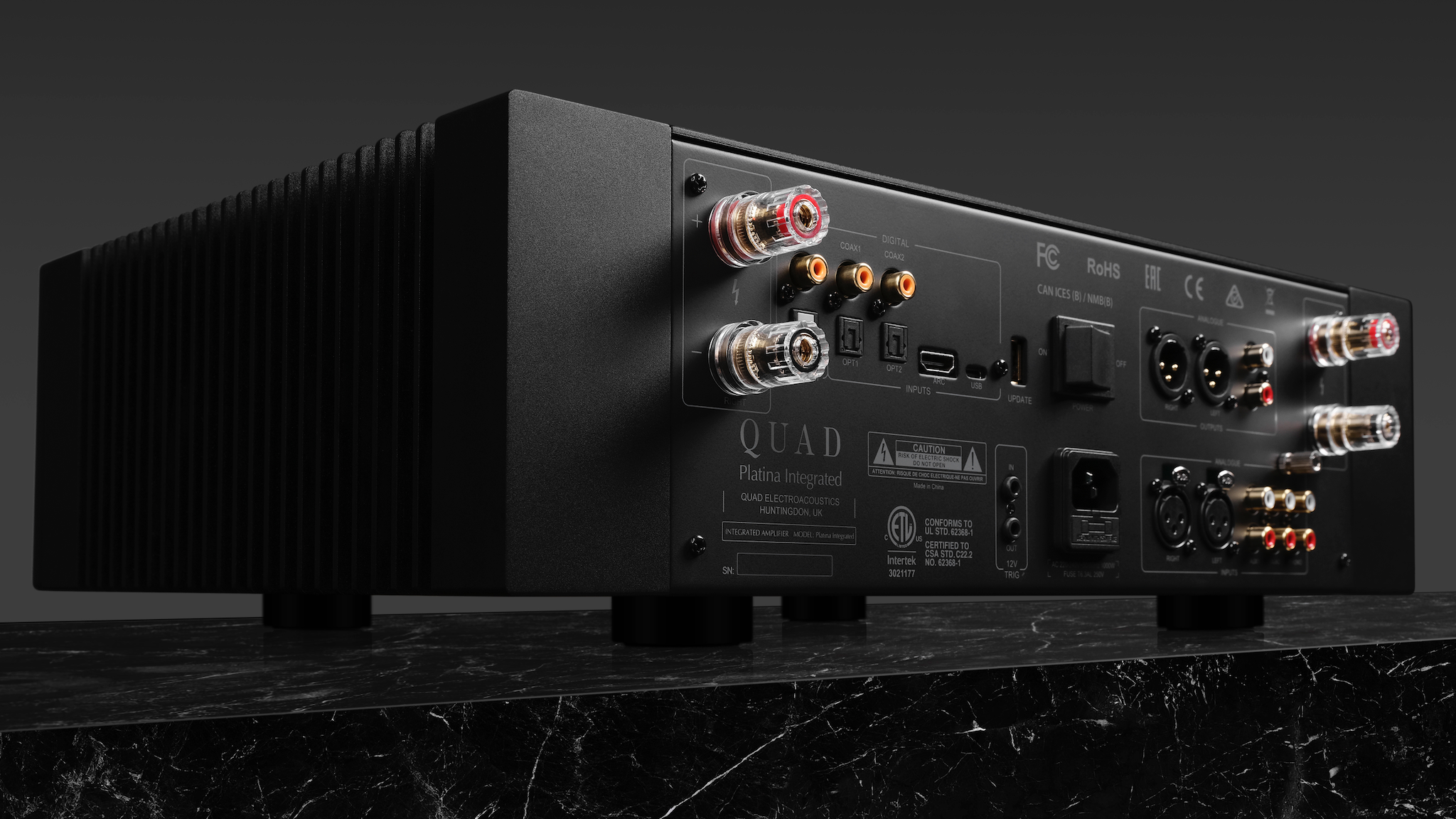 Rear view of the Quad Platina integrated amplifier on a dark gray background