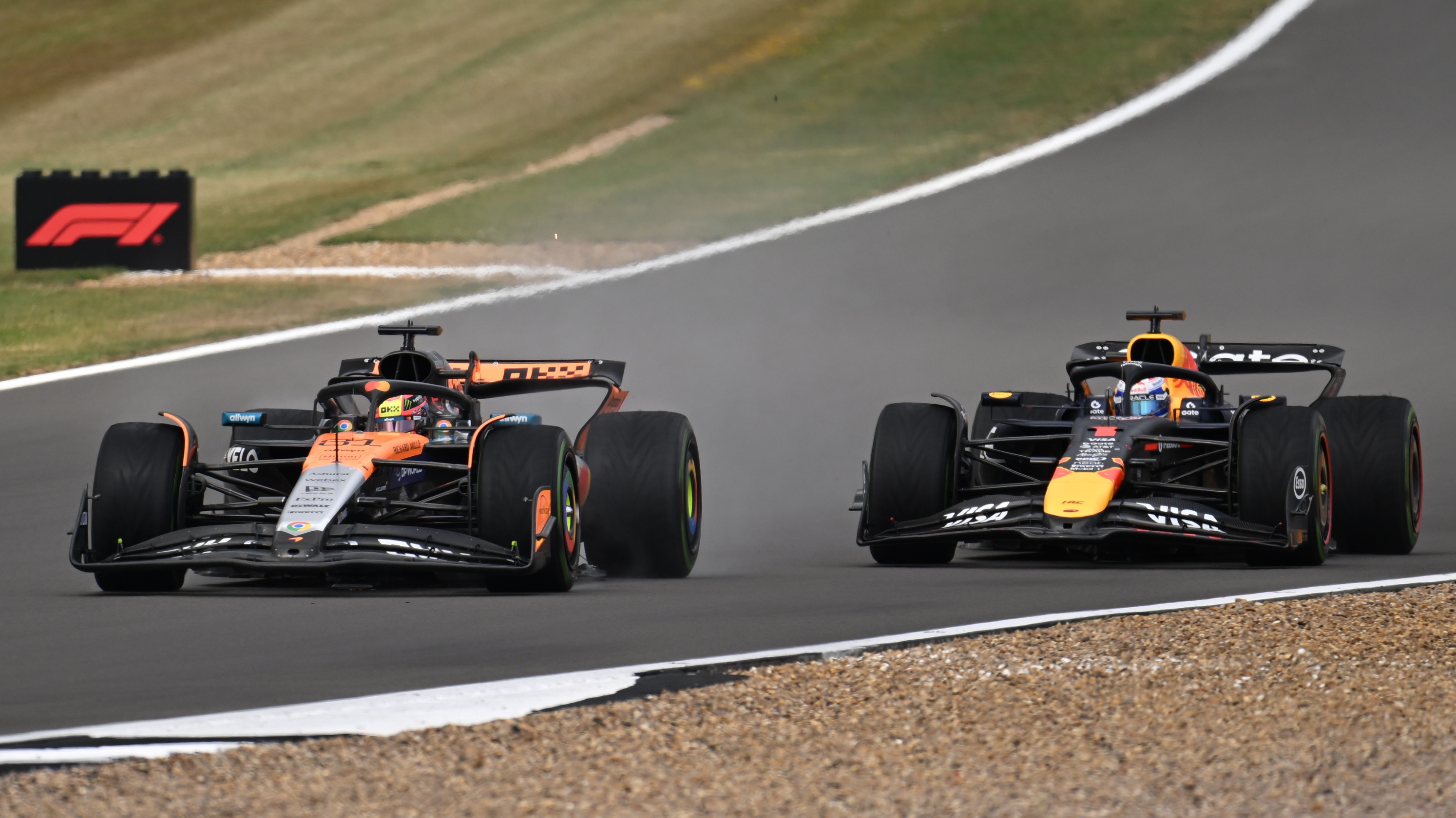 Oscar Piastri and Max Verstappen competing at Silverstone