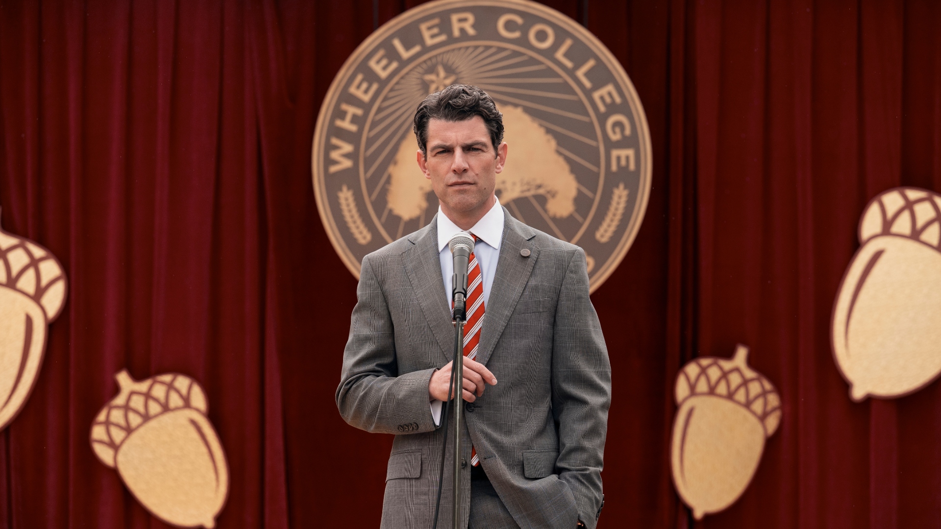 Jack stands in front of a microphone in the second season of A Man on the Inside